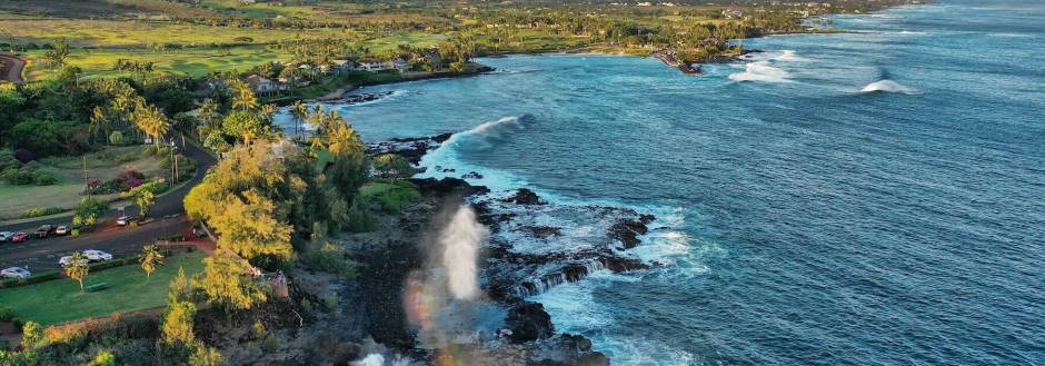 spouting horn at sunset with waves crashing